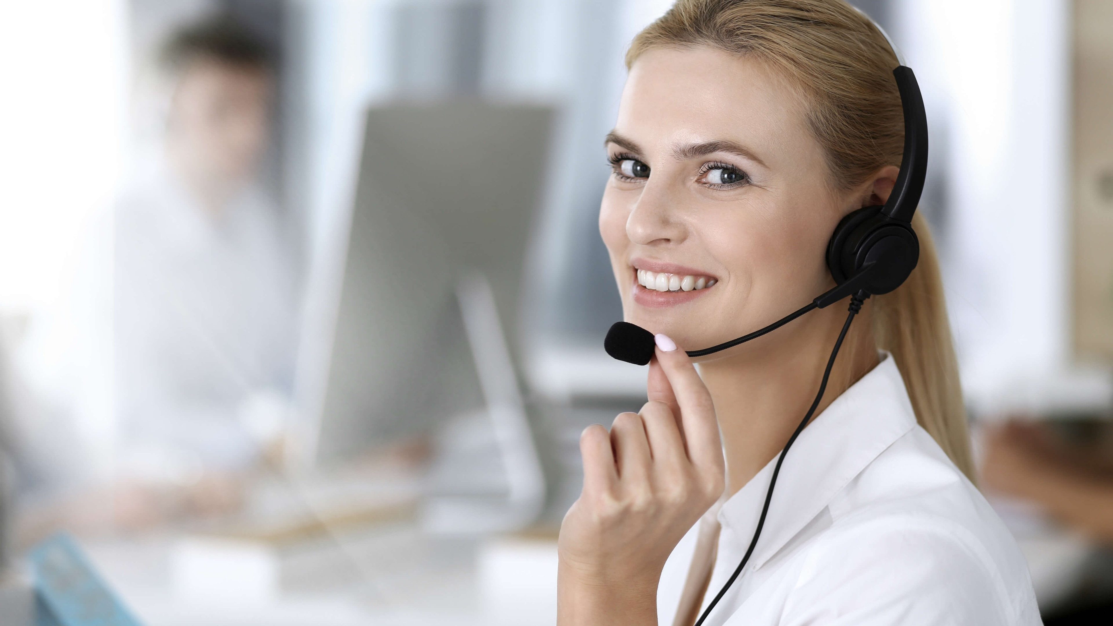 Customer support operator woman smiling at an office 