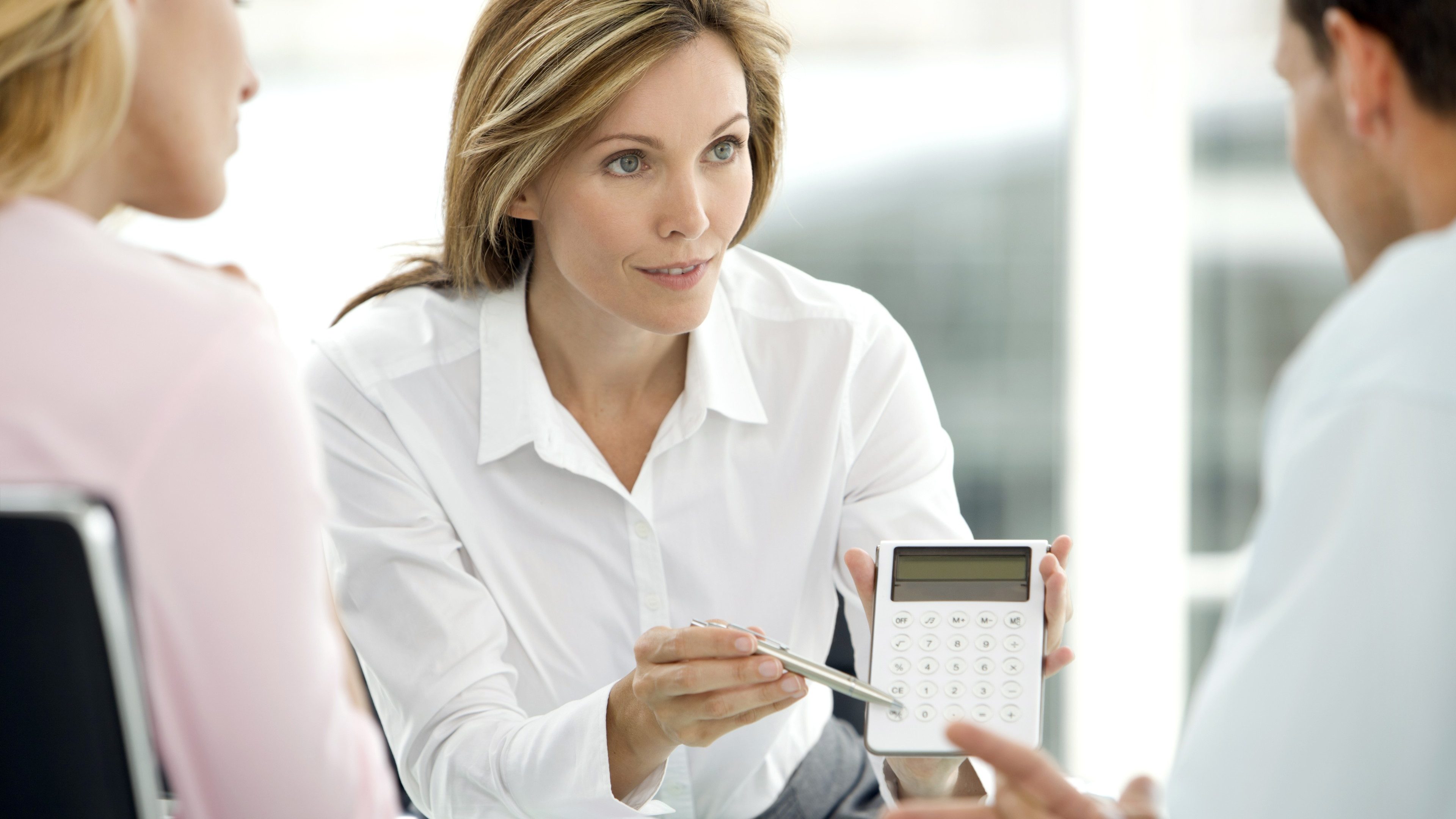 Couple dealing with a financial adviser at the bank