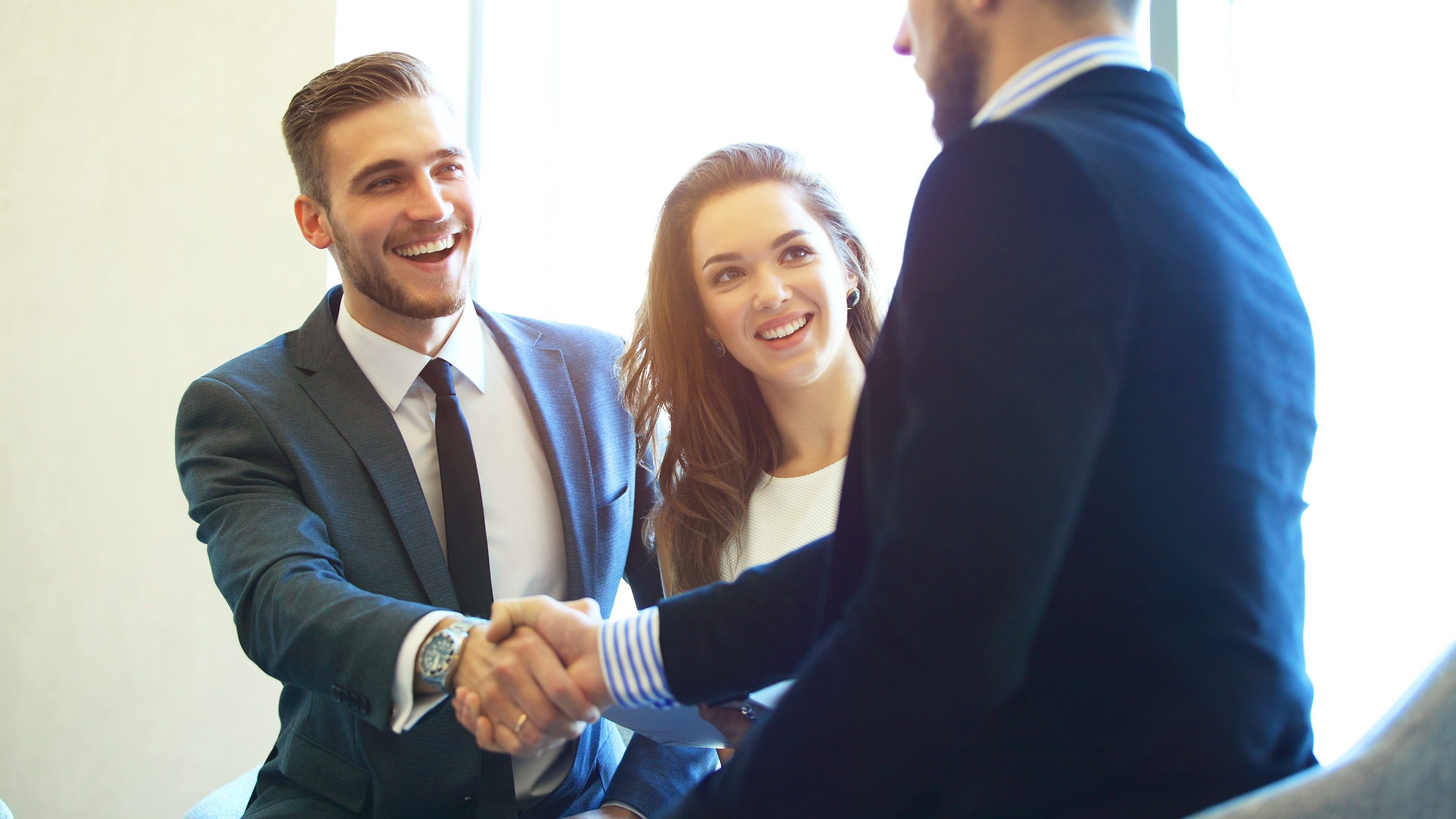 Business people shaking hands, finishing up a meeting