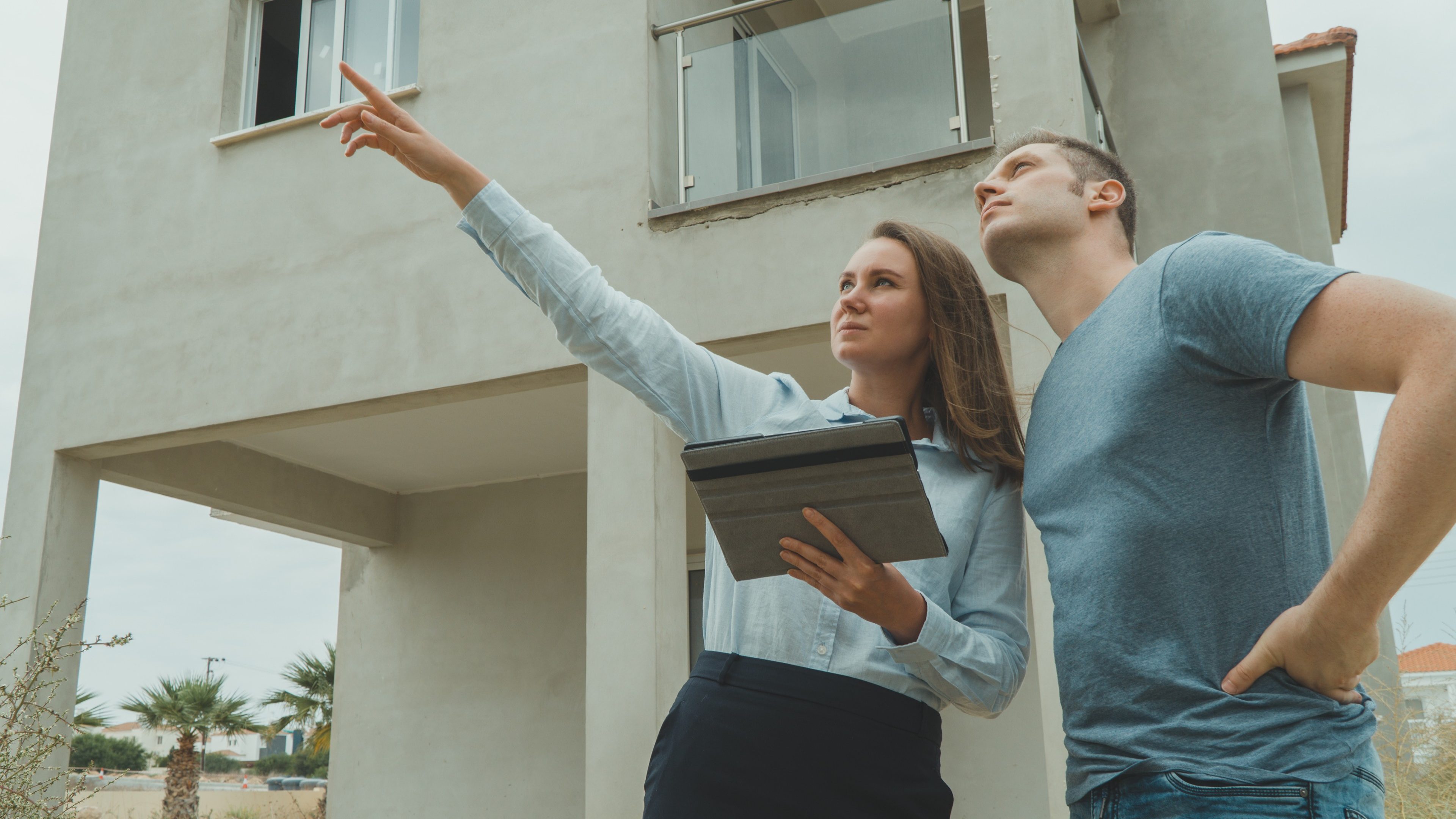 Real estate agent shows the development to his client.